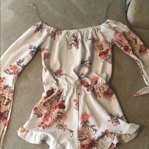 Floral romper with long sleeves